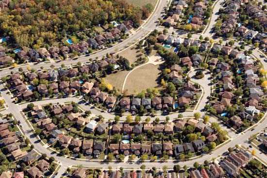 What helped the suburbs grow? 
