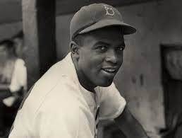 Who would break the color barrier in major league baseball in 1947?