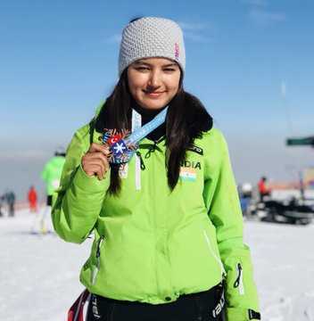 Who became the first Indian to win an international medal in skiing?