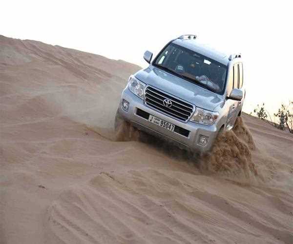 What other activities can I perform in Dubai desert other than sandboarding and dune bashing?